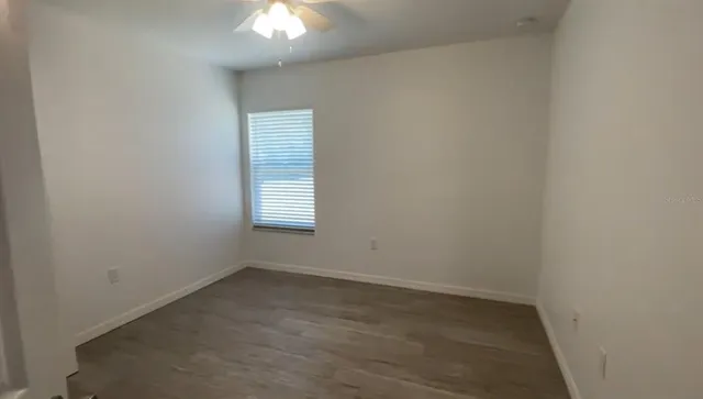 a view of a livingroom with wooden floor