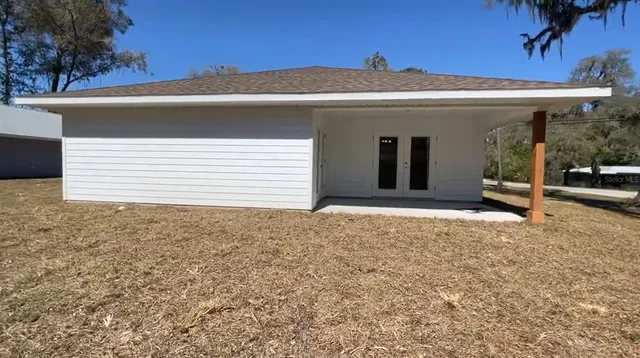a view of a house with a yard