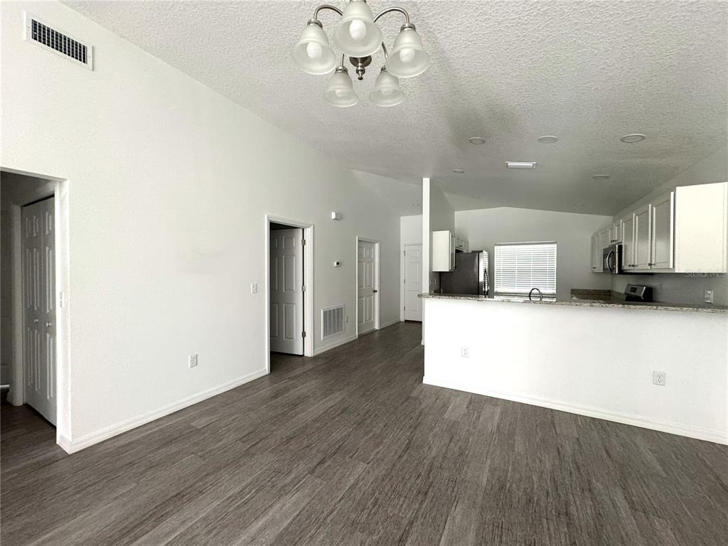 6386 East Rush Street Inverness, FL 34452 - Photo 5 of 21 a view of kitchen with refrigerator microwave and stove
