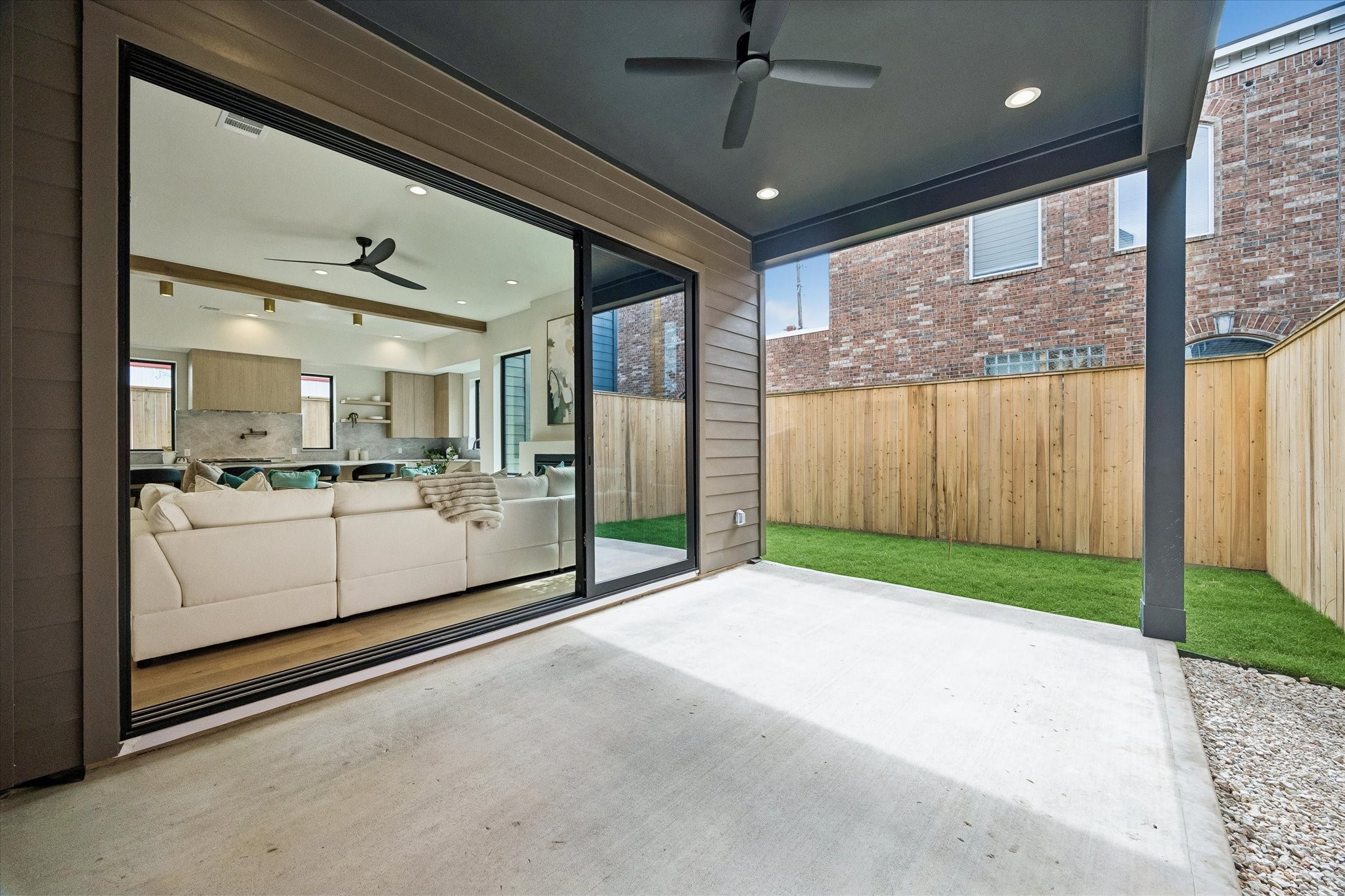 335 Harvard Street Houston, TX 77007 - Photo 33 of 35 Stackable sliding glass allows for seamless indoor/outdoor living with a large covered patio.