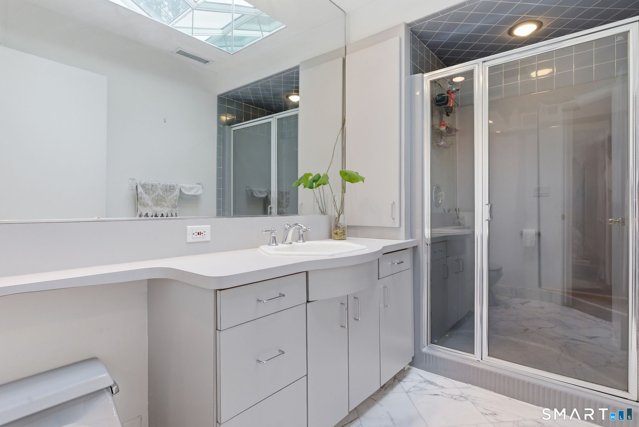 53 Dagmar Road Stamford, CT 06905 - Photo 29 of 40 Upper-level hallway bathroom with skylights