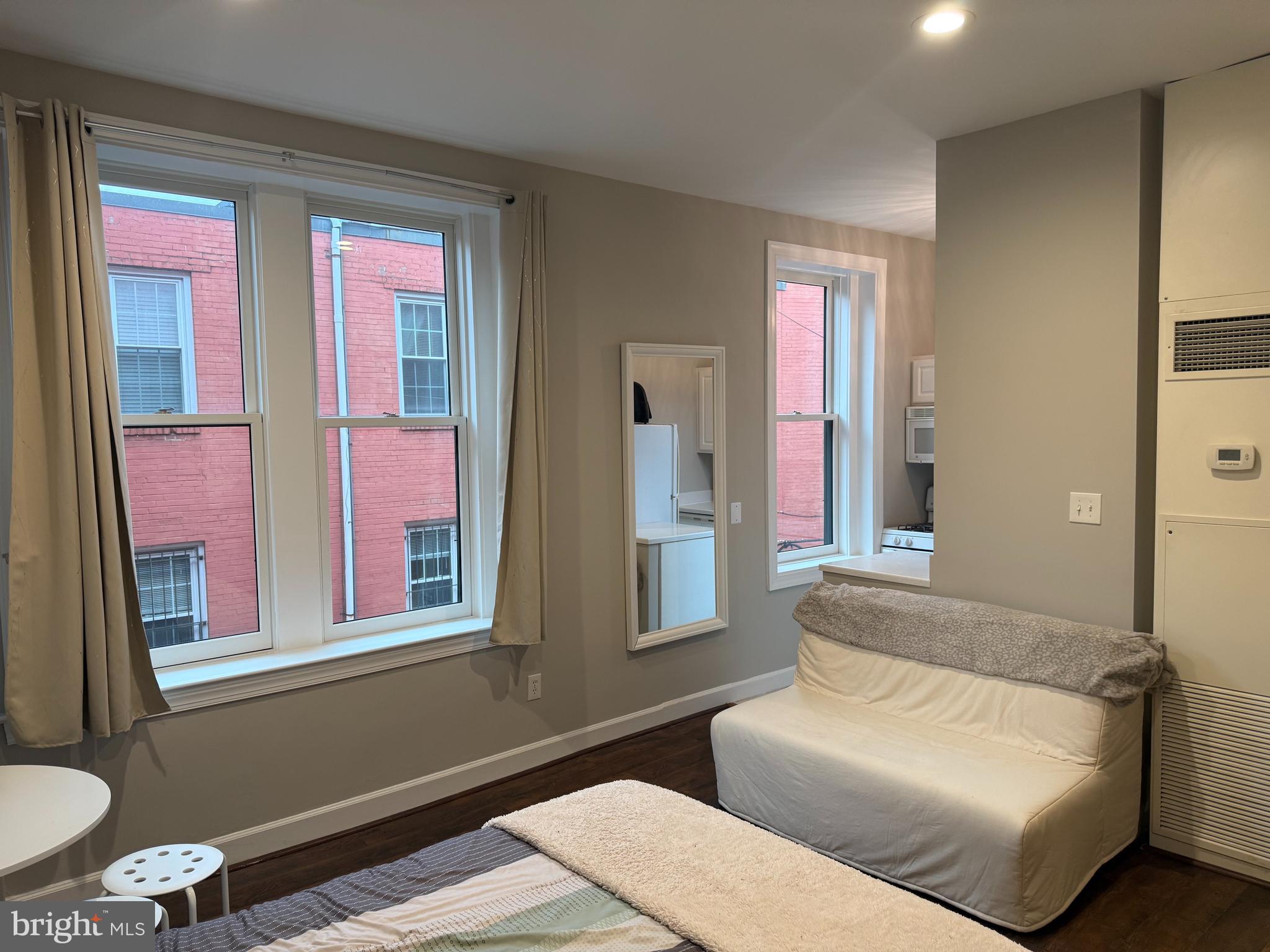 333 2nd Street Northeast, Unit 305 Washington, DC 20002 - Photo 8 of 17 a living room with furniture and a window