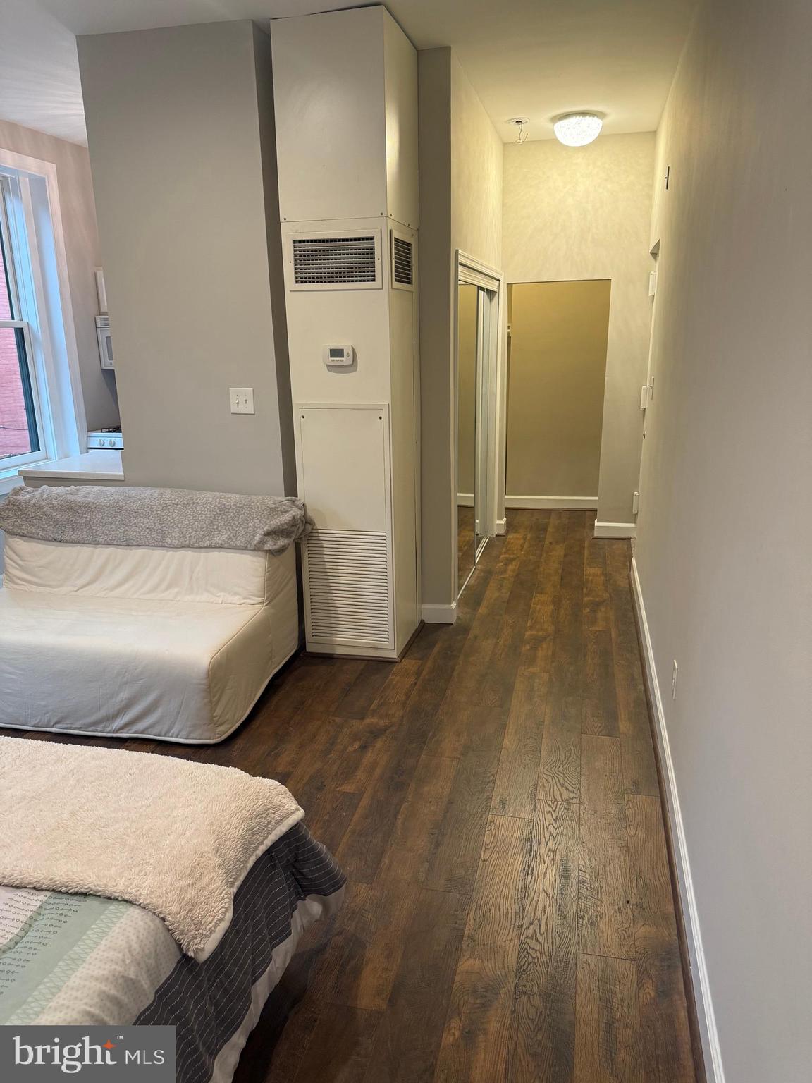 333 2nd Street Northeast, Unit 305 Washington, DC 20002 - Photo 10 of 17 a spacious bedroom with a bed and wooden floor