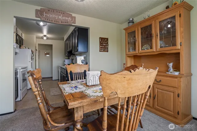 a view of a dining room with furniture window and outside view