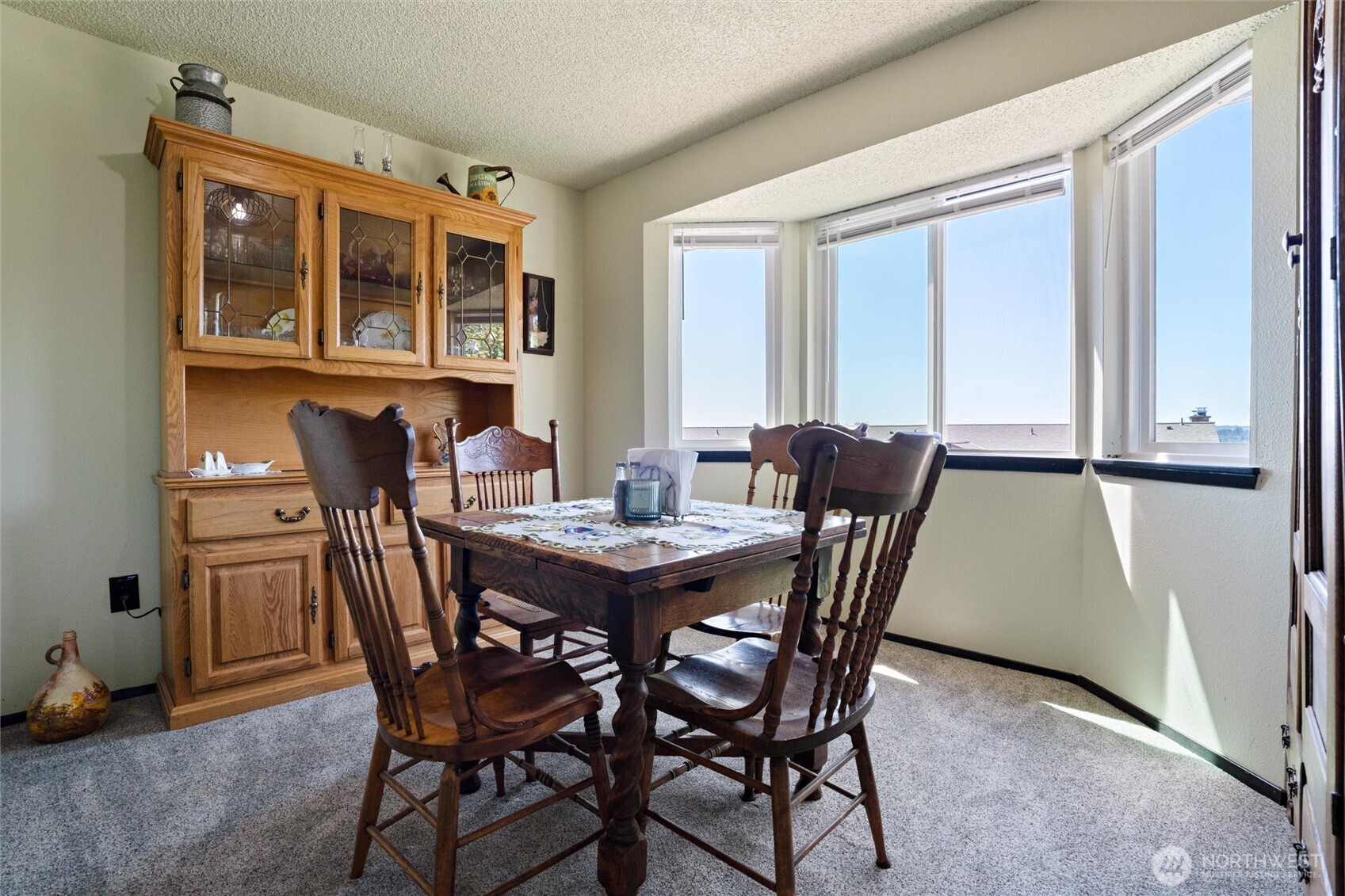 3560 Narrows View Lane Northeast, Unit 202 Bremerton, WA 98310 - Photo 14 of 30 a view of a dining room with furniture window and outside view