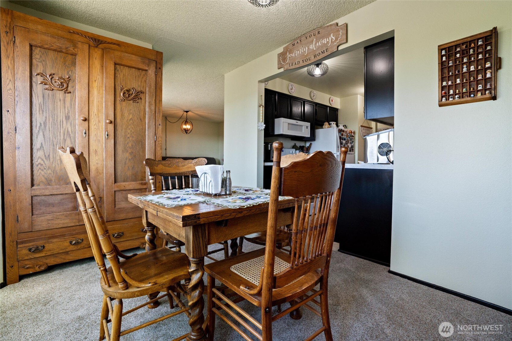 3560 Narrows View Lane Northeast, Unit 202 Bremerton, WA 98310 - Photo 15 of 30 a view of a dining room with furniture and wooden floor