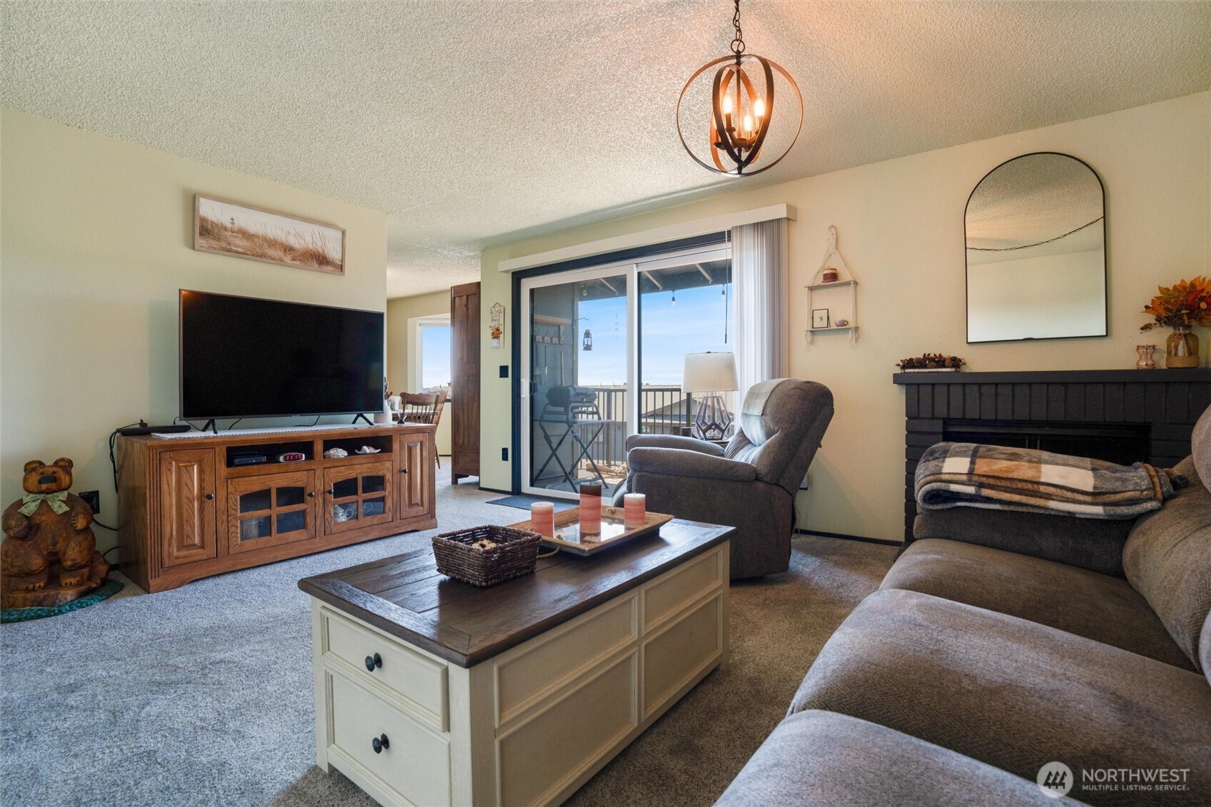 3560 Narrows View Lane Northeast, Unit 202 Bremerton, WA 98310 - Photo 16 of 30 a living room with furniture and a flat screen tv