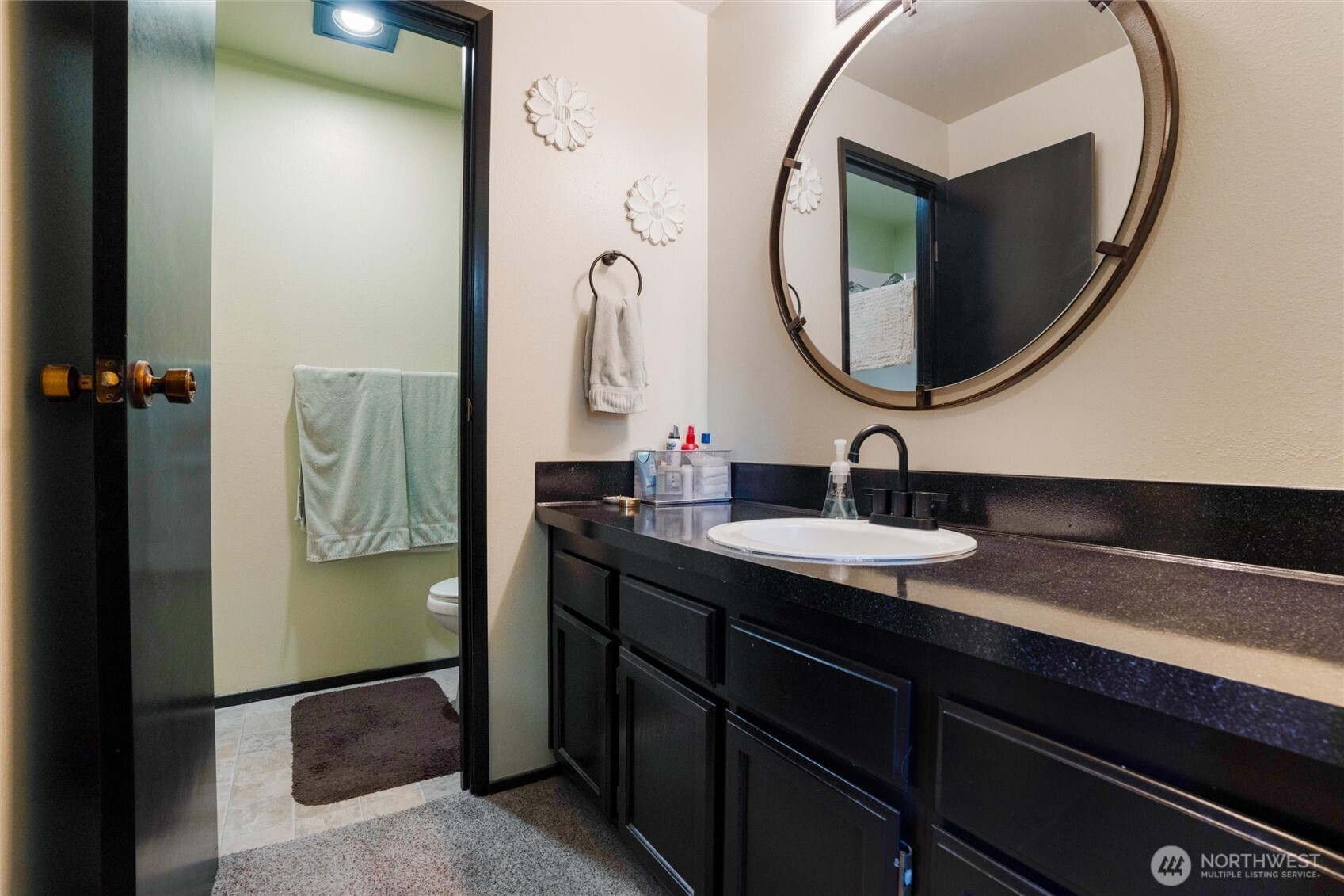 3560 Narrows View Lane Northeast, Unit 202 Bremerton, WA 98310 - Photo 25 of 30 a bathroom with a sink and a mirror