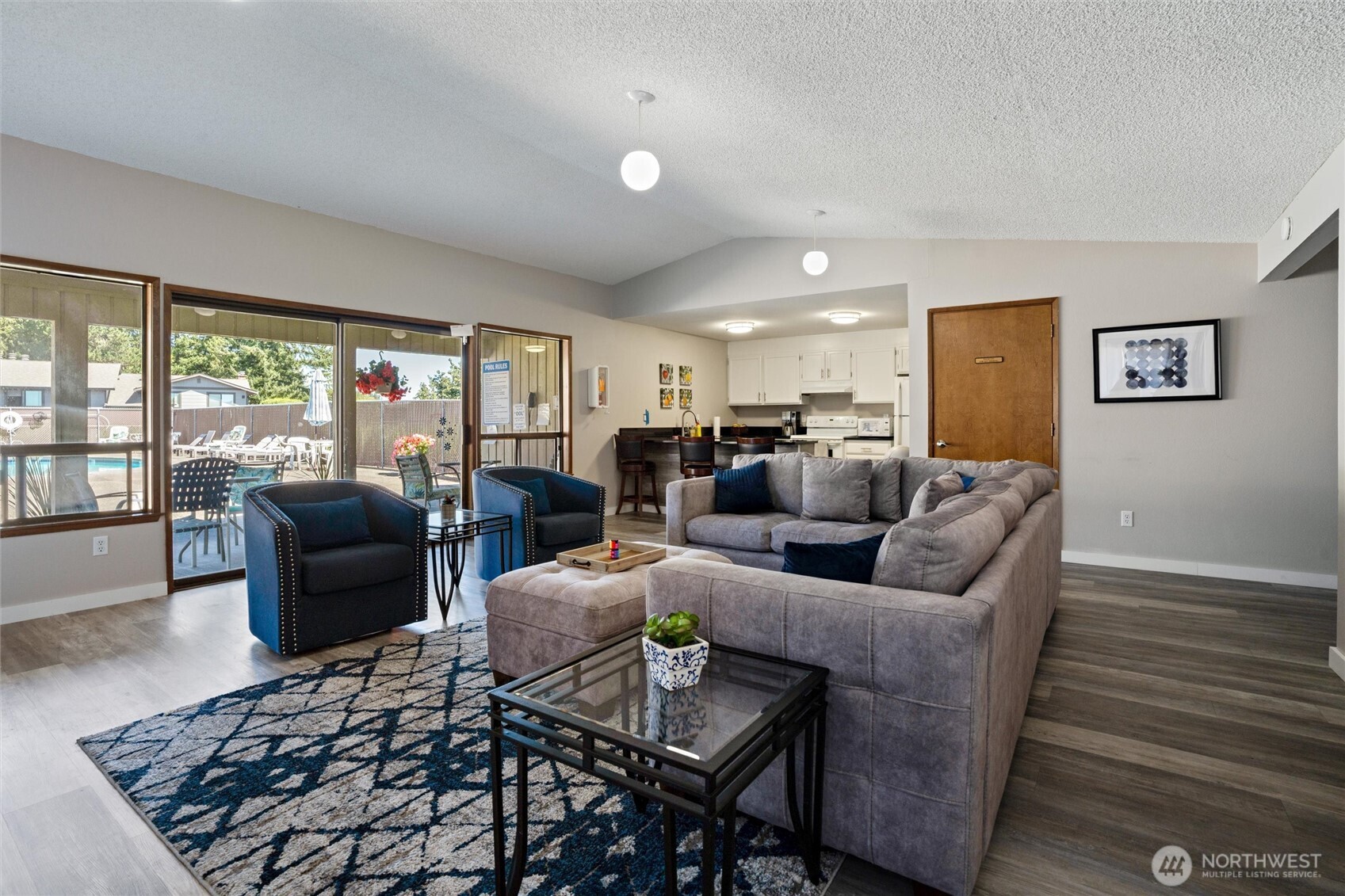 3560 Narrows View Lane Northeast, Unit 202 Bremerton, WA 98310 - Photo 29 of 30 a living room with furniture and a large window