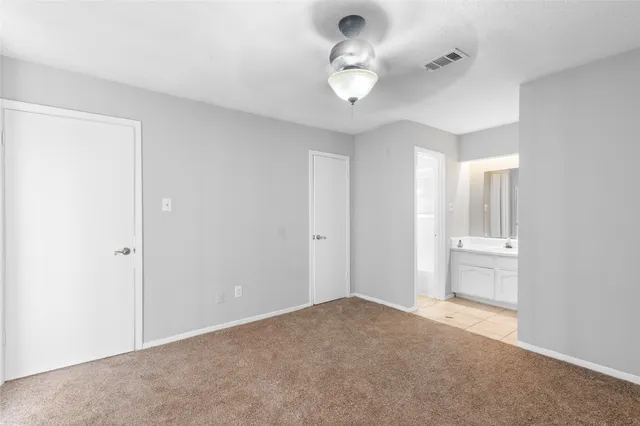 a view of an empty room and a window