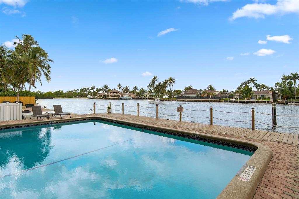 2611 North Riverside Drive, Unit 1106 Pompano Beach, FL 33062 - Photo 17 of 28 a view of a swimming pool and an outdoor seating