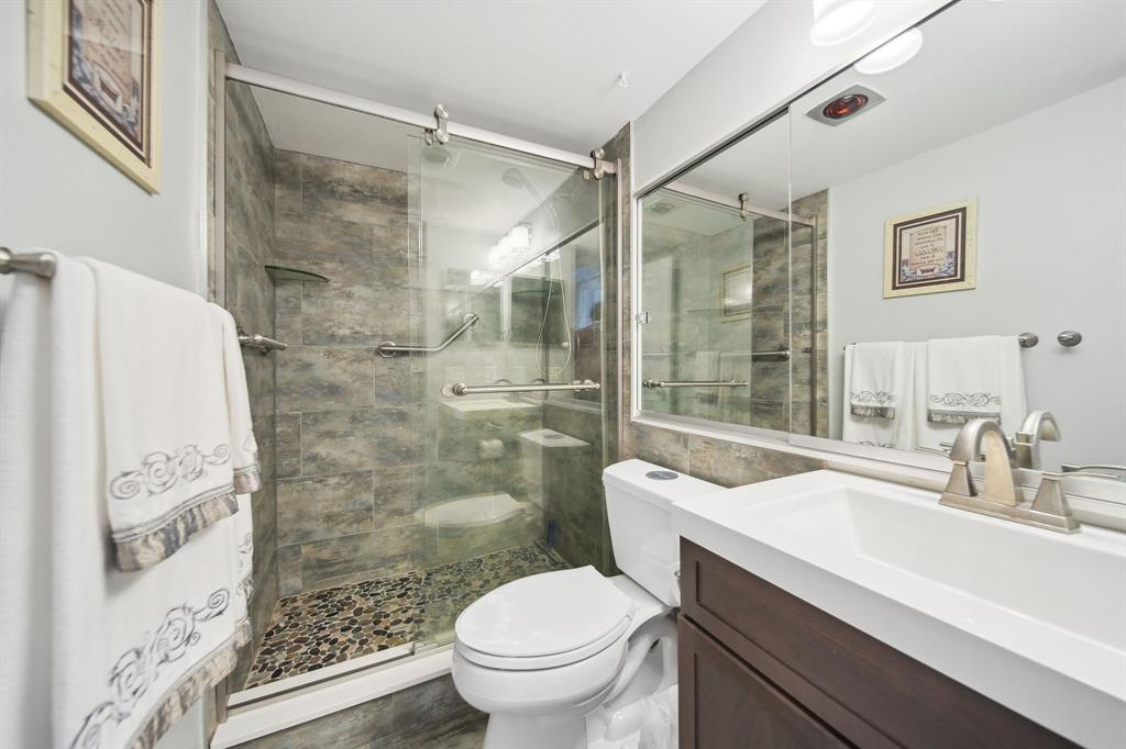 2611 North Riverside Drive, Unit 1106 Pompano Beach, FL 33062 - Photo 25 of 28 a bathroom with a sink toilet and shower