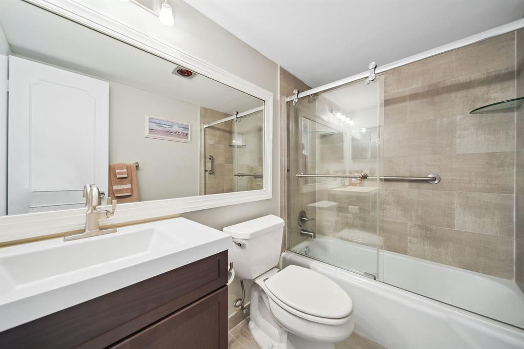 2611 North Riverside Drive, Unit 1106 Pompano Beach, FL 33062 - Photo 26 of 28 a bathroom with a sink a toilet and shower