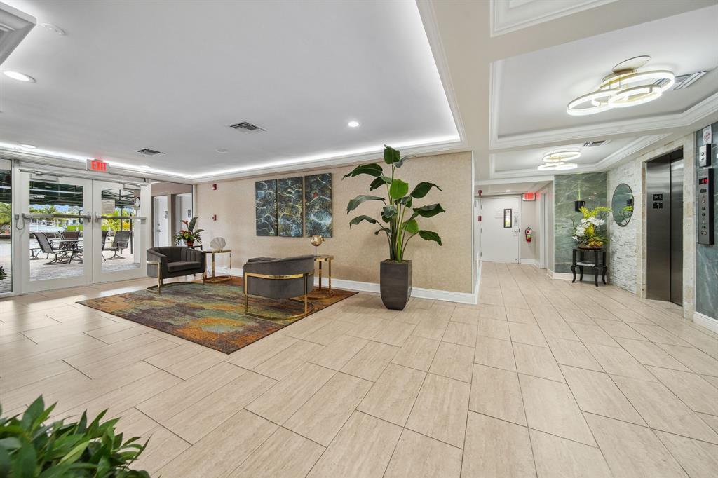 2611 North Riverside Drive, Unit 1106 Pompano Beach, FL 33062 - Photo 28 of 28 a view of livingroom with kitchen and furniture