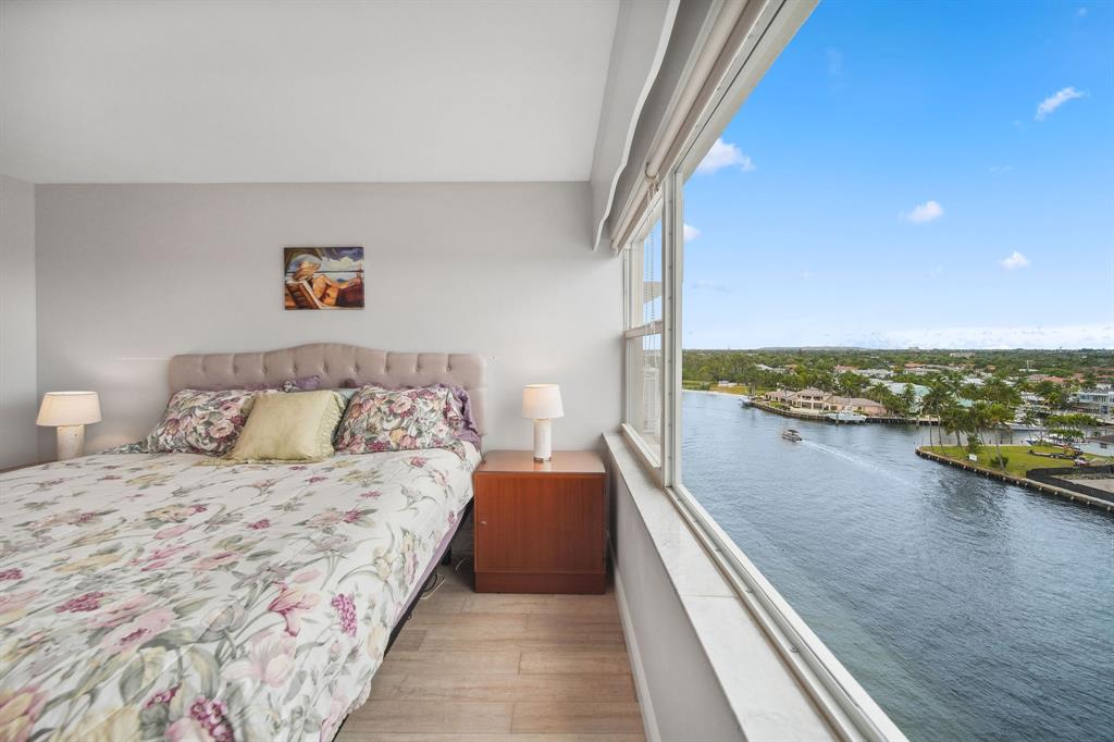 2611 North Riverside Drive, Unit 1106 Pompano Beach, FL 33062 - Photo 5 of 28 a bedroom with a bed and ocean view