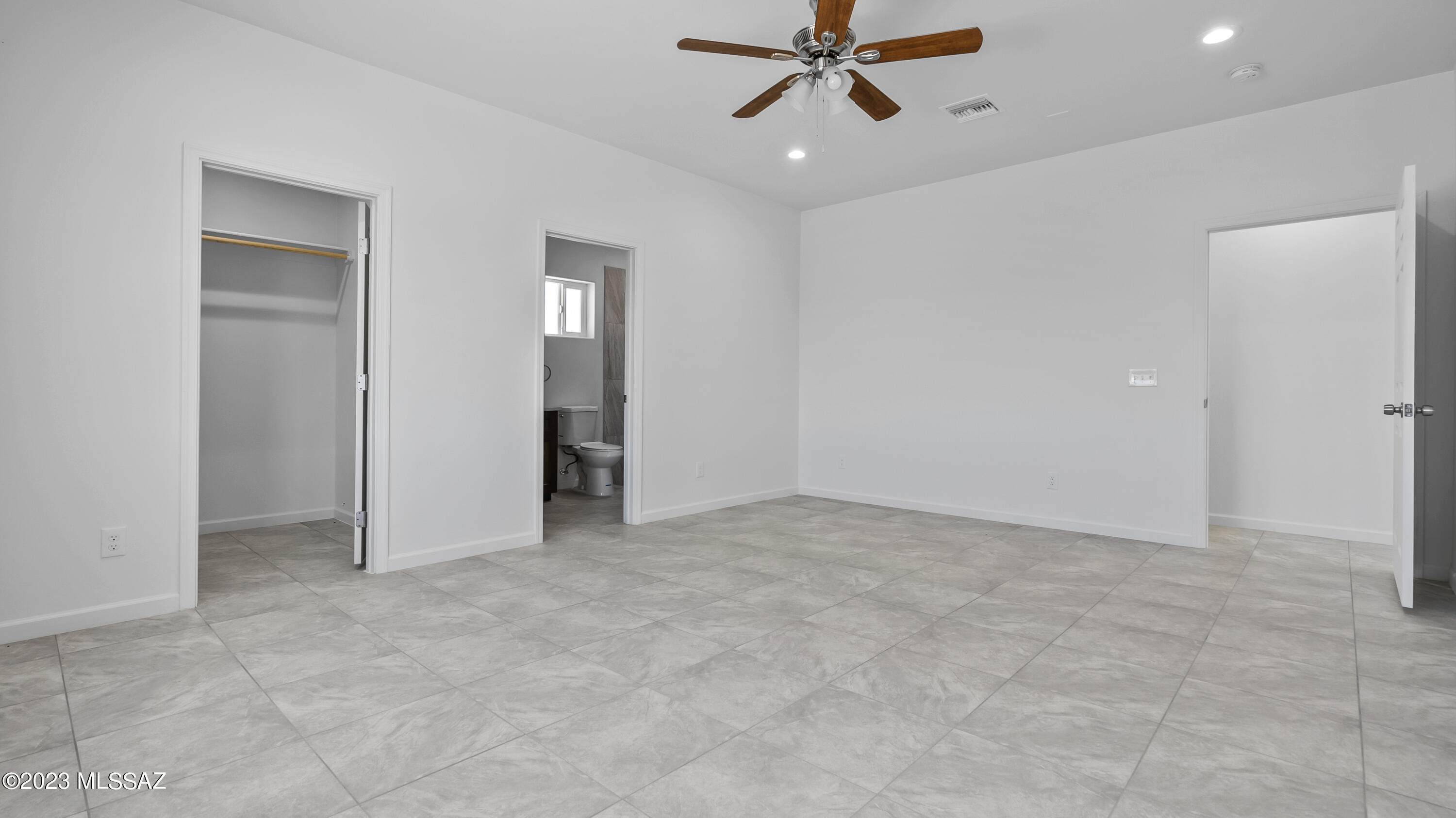 1832 America Court Rio Rico, AZ 85648 - Photo 18 of 19 an empty room with closet and a ceiling fan