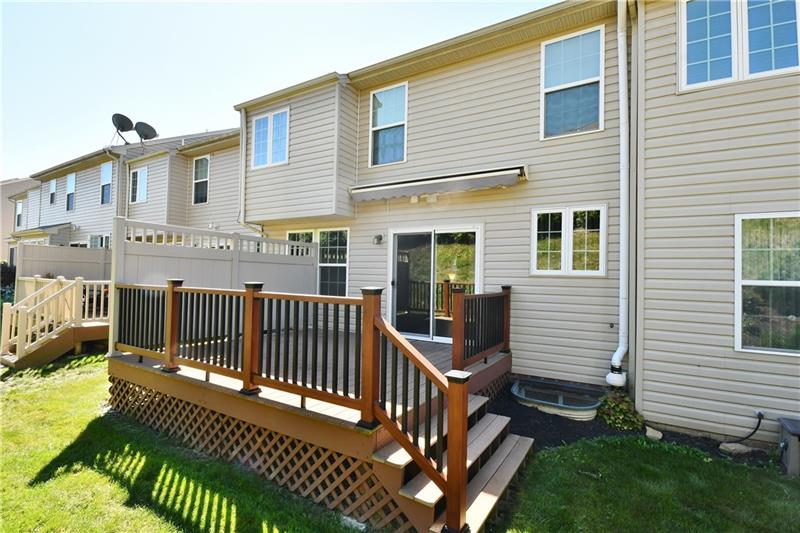 The maintenance-free deck with roll out awning and privacy wall are great for relaxing or entertaining outside. 