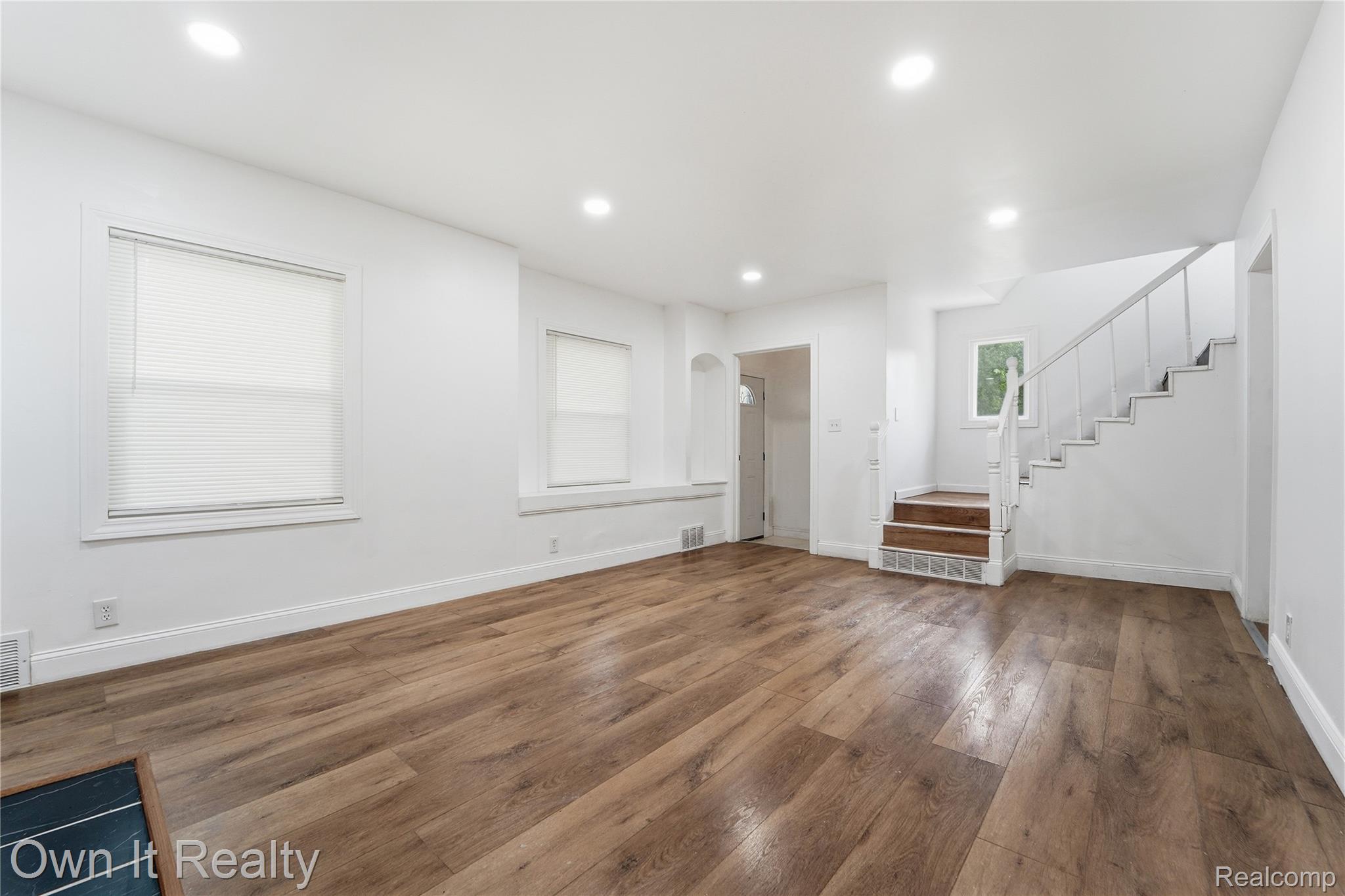 17351 Appoline Street Detroit, MI 48235 - Photo 4 of 34 Spacious living area featuring wood-finish flooring, recessed lighting, and white walls