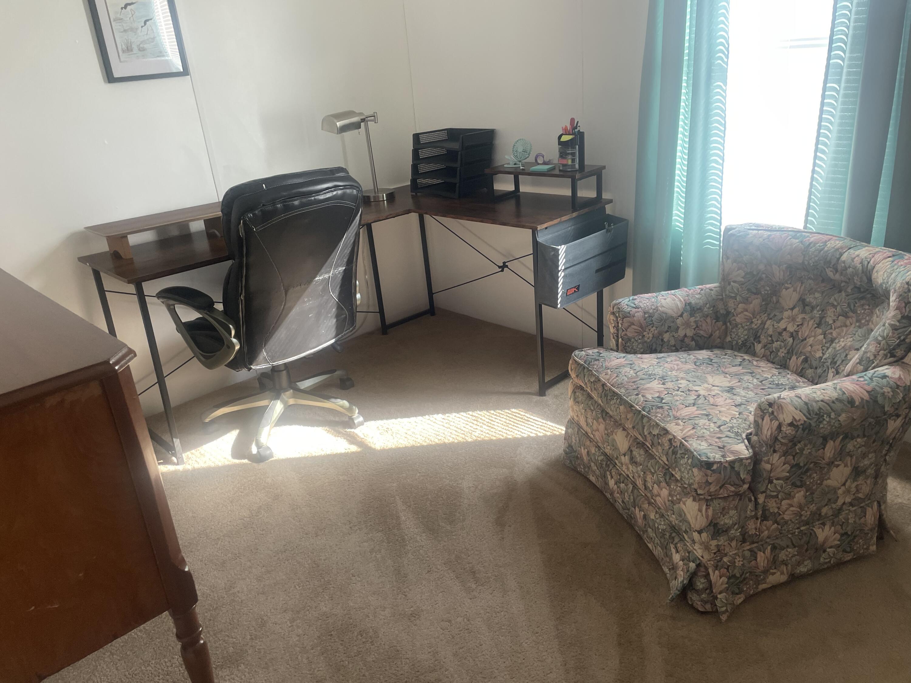 4281 Southwest 15th Way Okeechobee, FL 34974 - Photo 12 of 12 a living room with furniture and a window