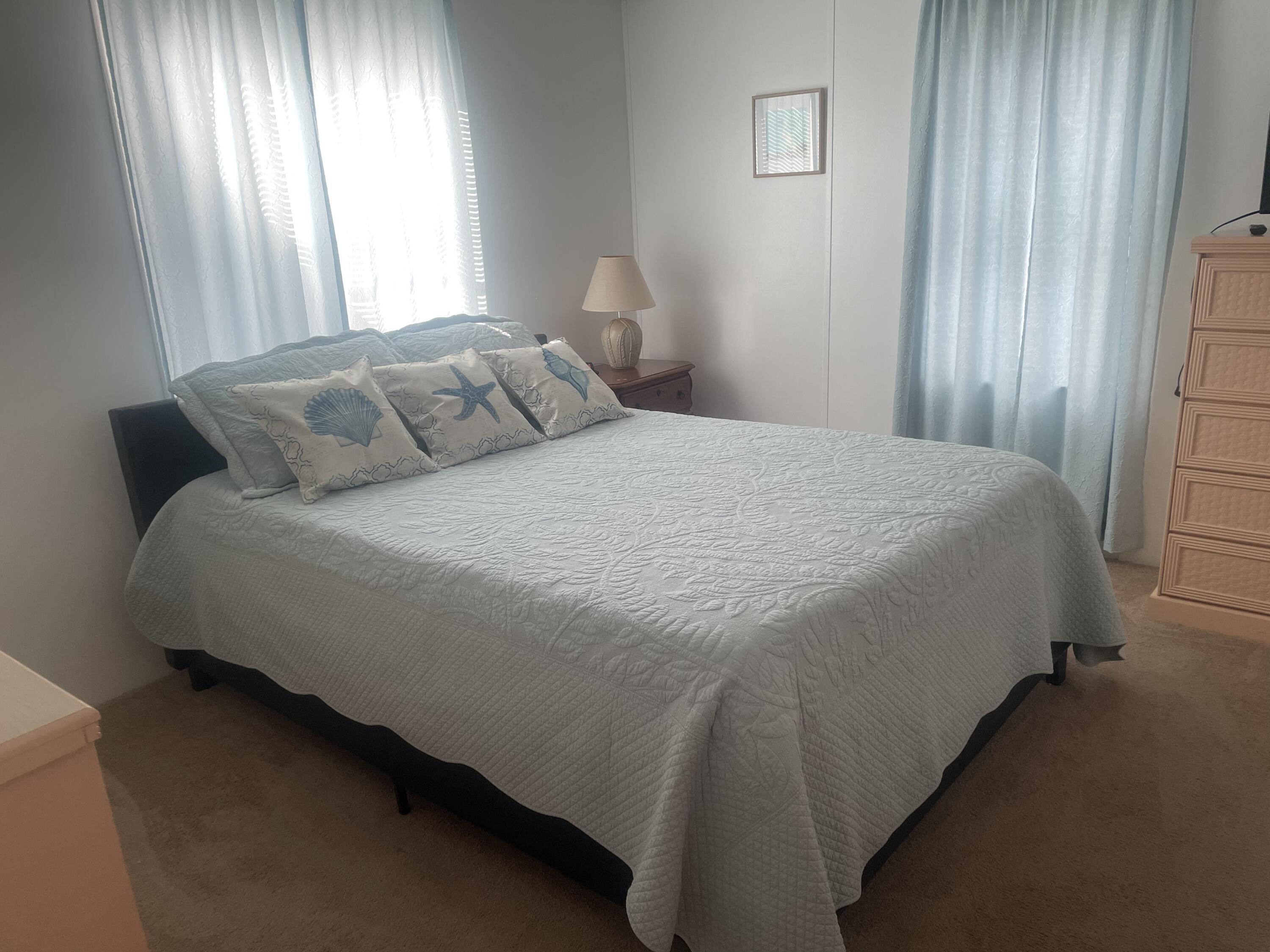 4281 Southwest 15th Way Okeechobee, FL 34974 - Photo 8 of 12 a bedroom with a bed and window