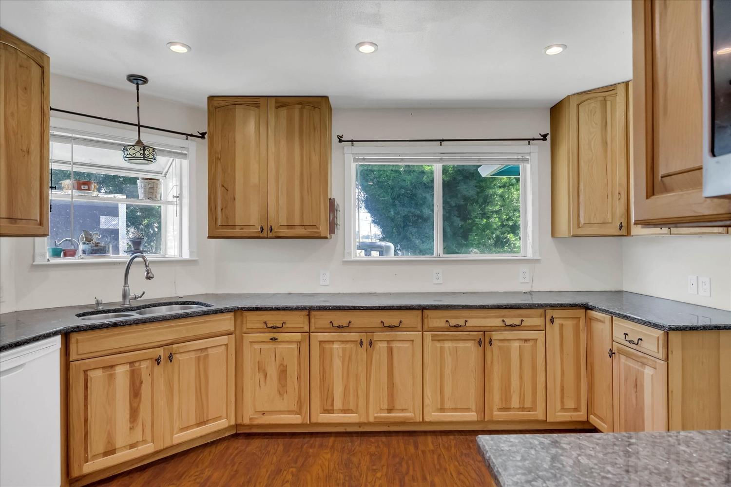 39640 South River Road Clarksburg, CA 95612 - Photo 11 of 25 a kitchen with wooden cabinets and sink