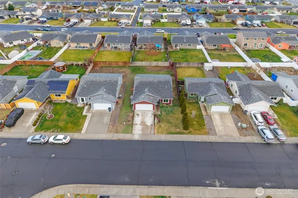 an aerial view of residential houses with outdoor space