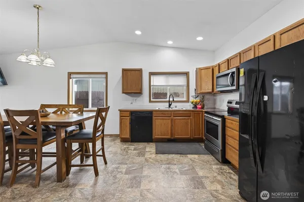 a kitchen with a sink stove and refrigerator