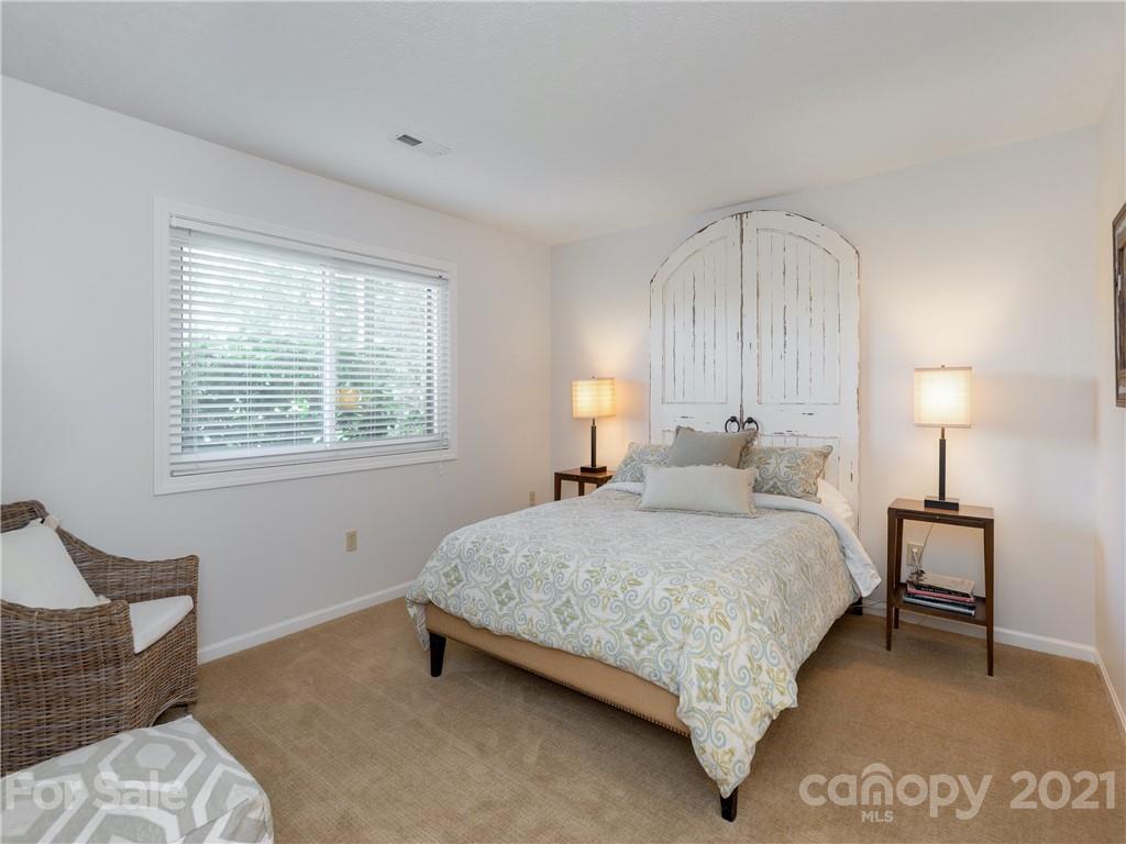 116 Country Ridge Road Laurel Park, NC 28739 - Photo 22 of 26 a bedroom with a bed and window
