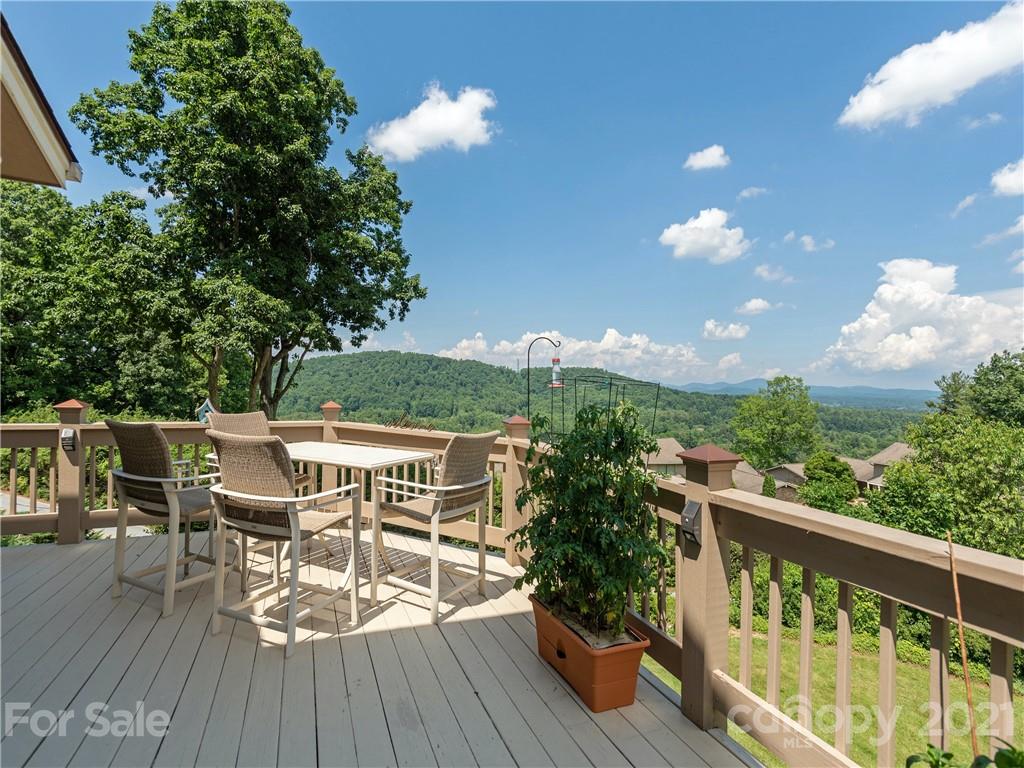 116 Country Ridge Road Laurel Park, NC 28739 - Photo 10 of 26 a view of a balcony with furniture and wooden floor