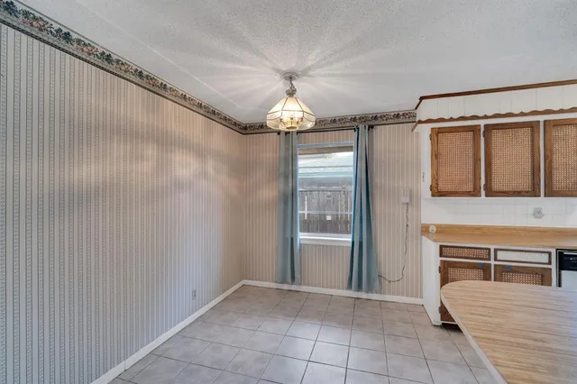 a view of a hallway with a chandelier