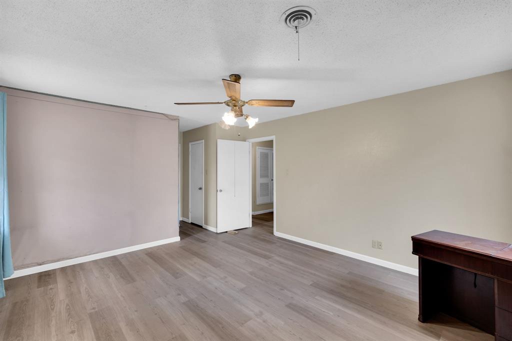 1320 Apache Street Arlington, TX 76012 - Photo 16 of 27 a view of an empty room with wooden floor