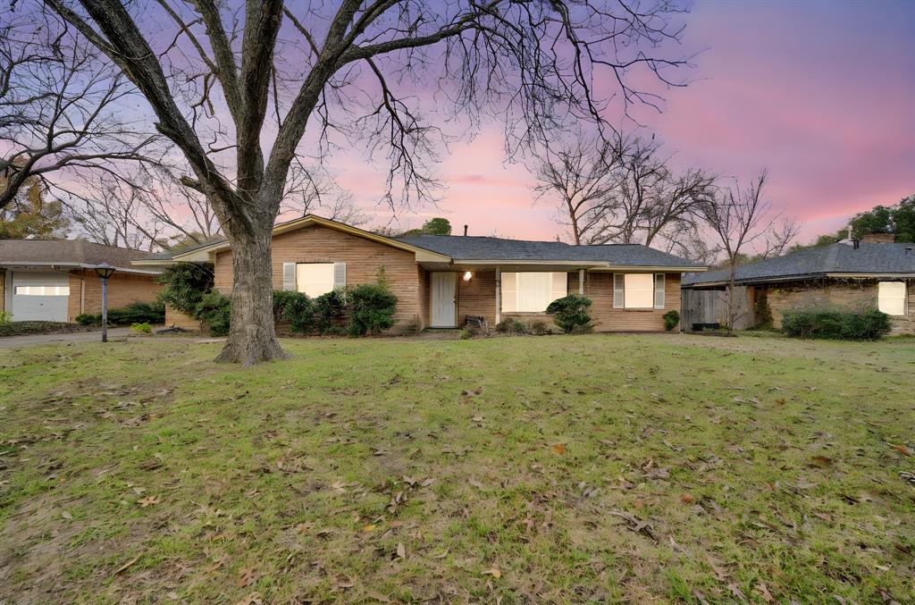 1320 Apache Street Arlington, TX 76012 - Photo 2 of 27 a front view of a house with a yard