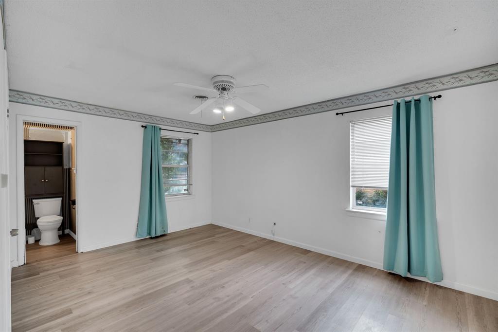 1320 Apache Street Arlington, TX 76012 - Photo 23 of 27 a view of empty room with wooden floor and fan