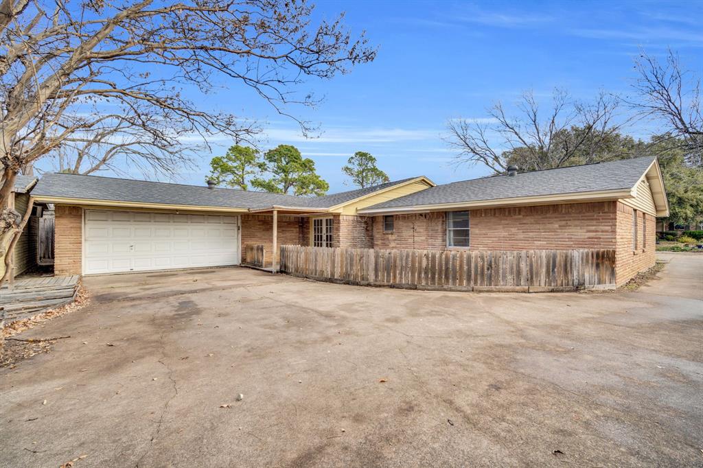 1320 Apache Street Arlington, TX 76012 - Photo 24 of 27 front view of a house with a yard