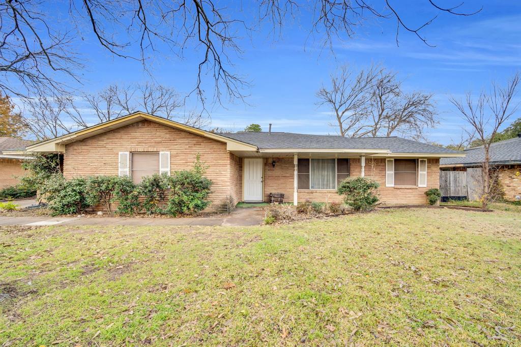 1320 Apache Street Arlington, TX 76012 - Photo 4 of 27 a view of a house with a yard