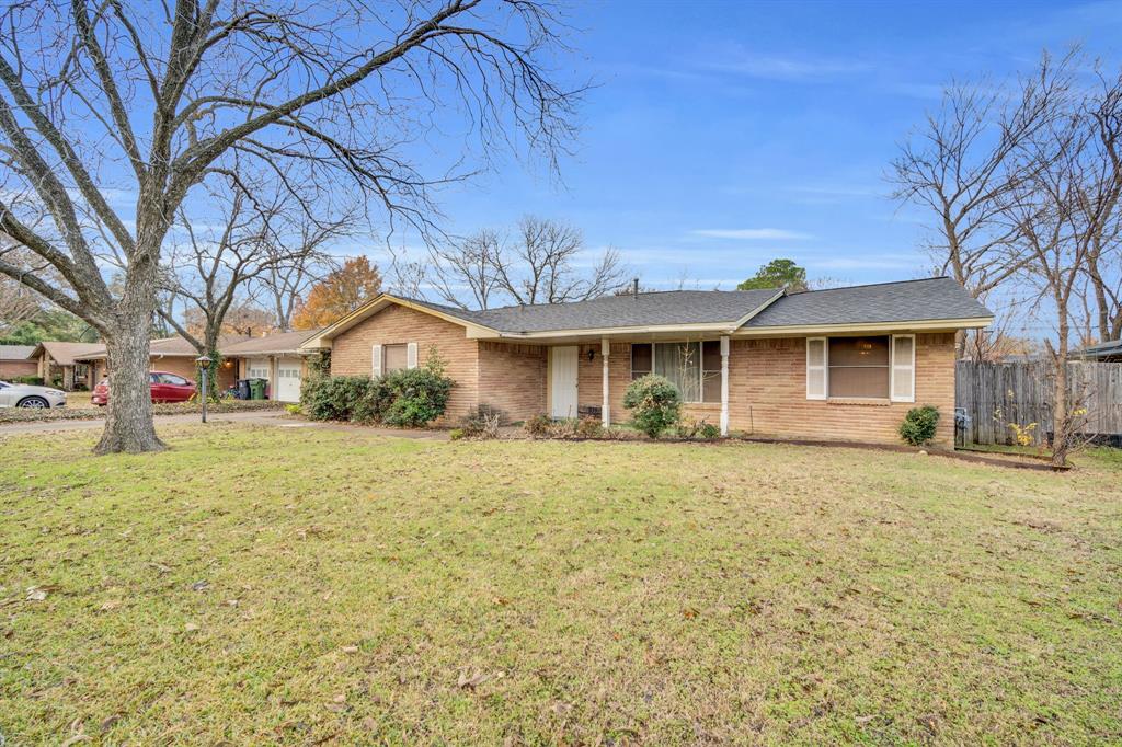 1320 Apache Street Arlington, TX 76012 - Photo 5 of 27 a front view of a house with a yard