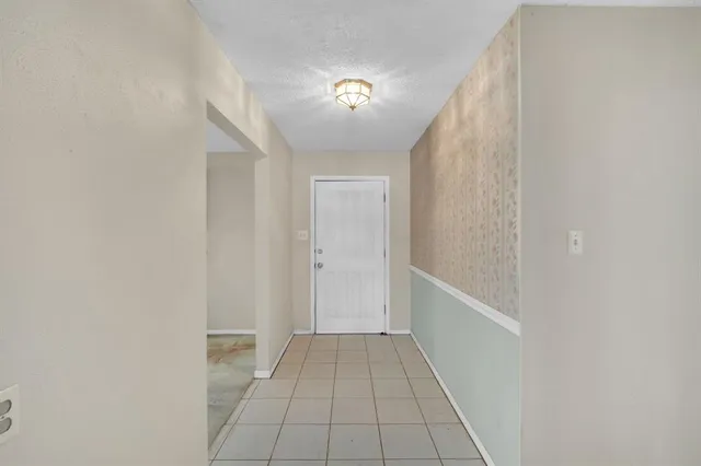 a view of a hallway with a white walls