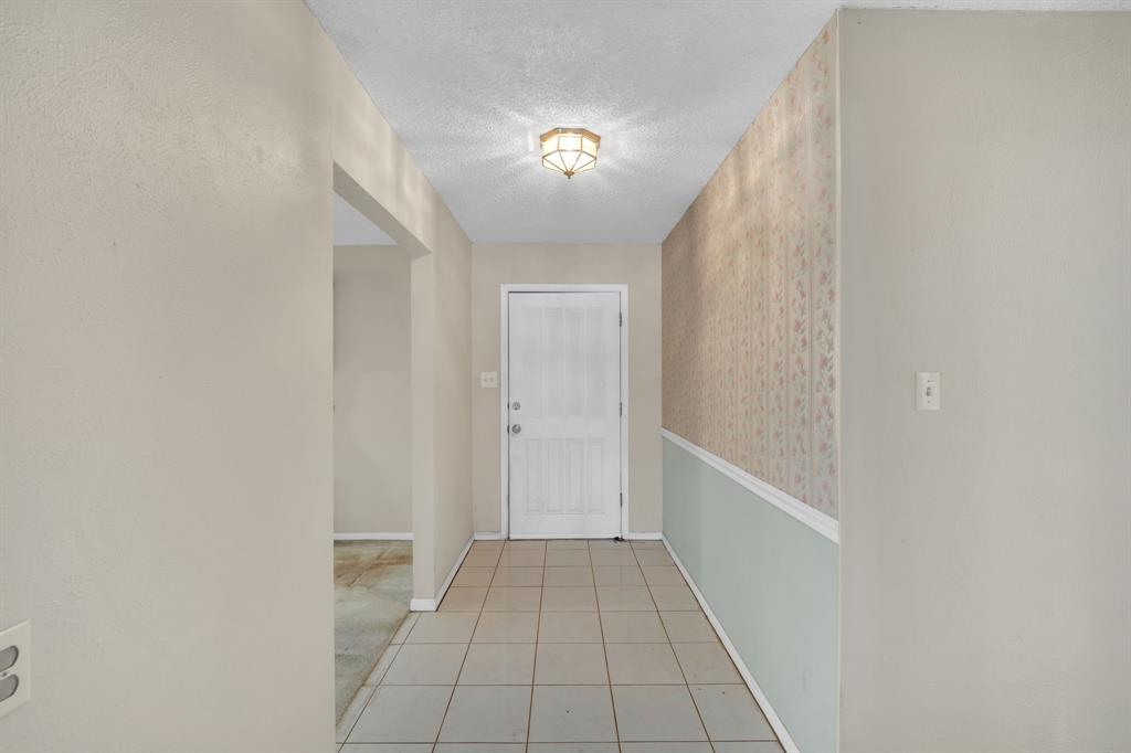 1320 Apache Street Arlington, TX 76012 - Photo 6 of 27 a view of a hallway with a white walls