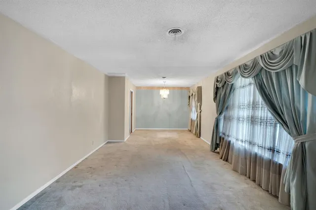a view of a hallway with staircase