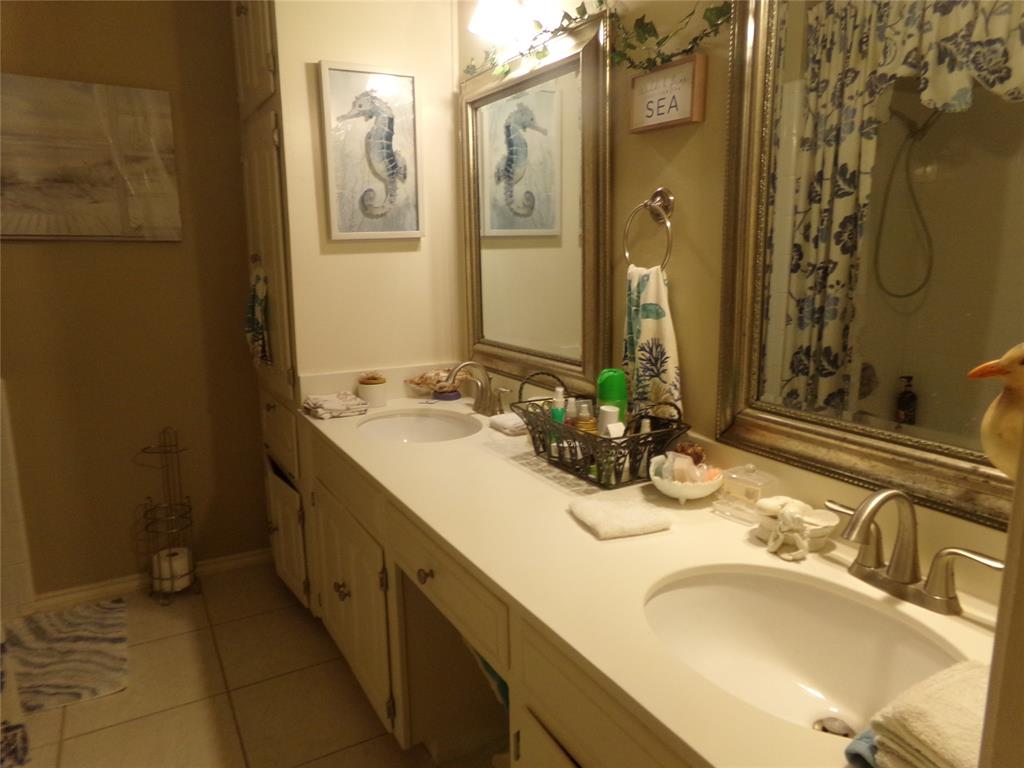 5110 Wedgefield Road Granbury, TX 76049 - Photo 13 of 23 Double vanity featuring two integrated sinks set into a light-toned countertop