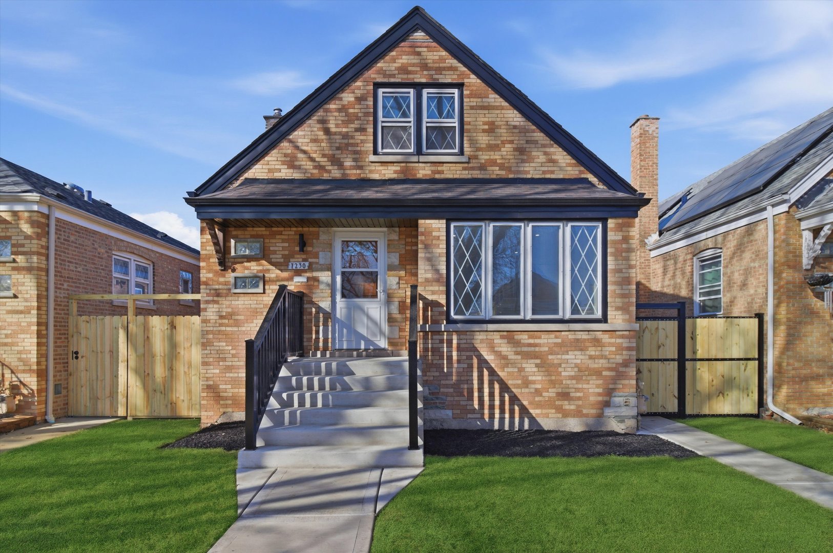 7230 South Avers Avenue Chicago, IL 60629 - Photo 1 of 44 a front view of a house with garden
