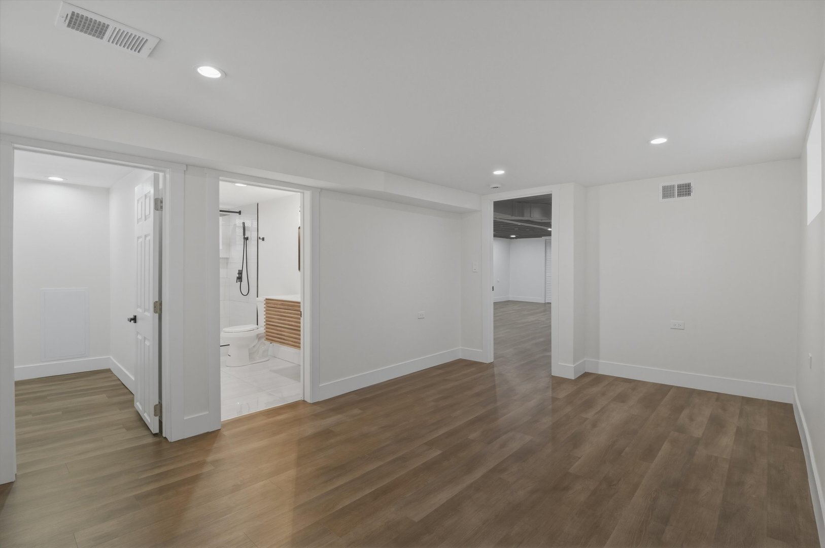 7230 South Avers Avenue Chicago, IL 60629 - Photo 14 of 44 wooden floor in an empty room with a window