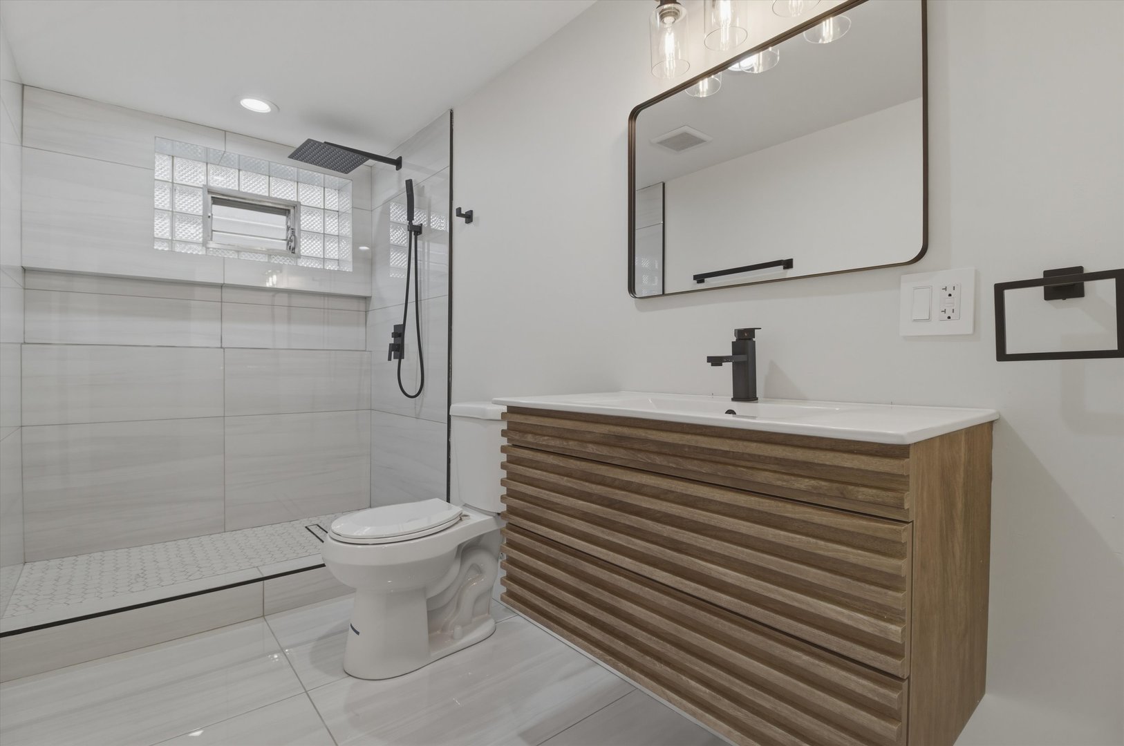 7230 South Avers Avenue Chicago, IL 60629 - Photo 16 of 44 a bathroom with a sink toilet and shower