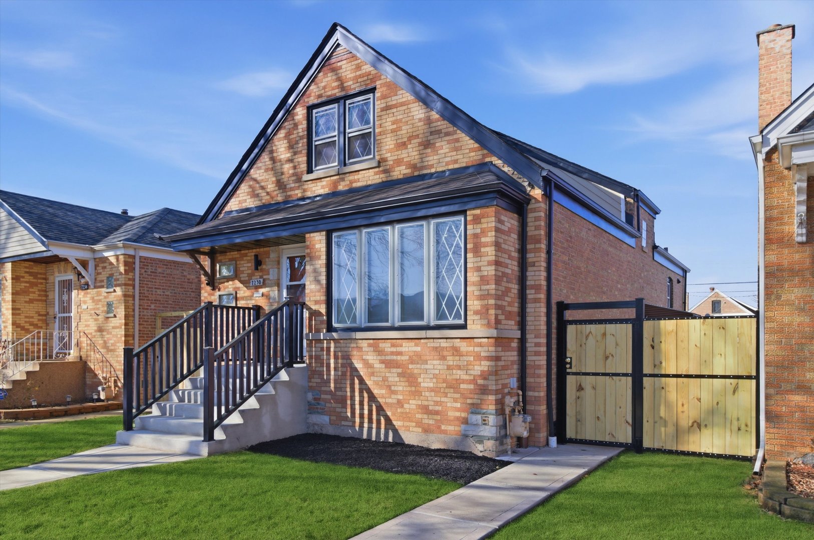 7230 South Avers Avenue Chicago, IL 60629 - Photo 2 of 44 a front view of a house with garden