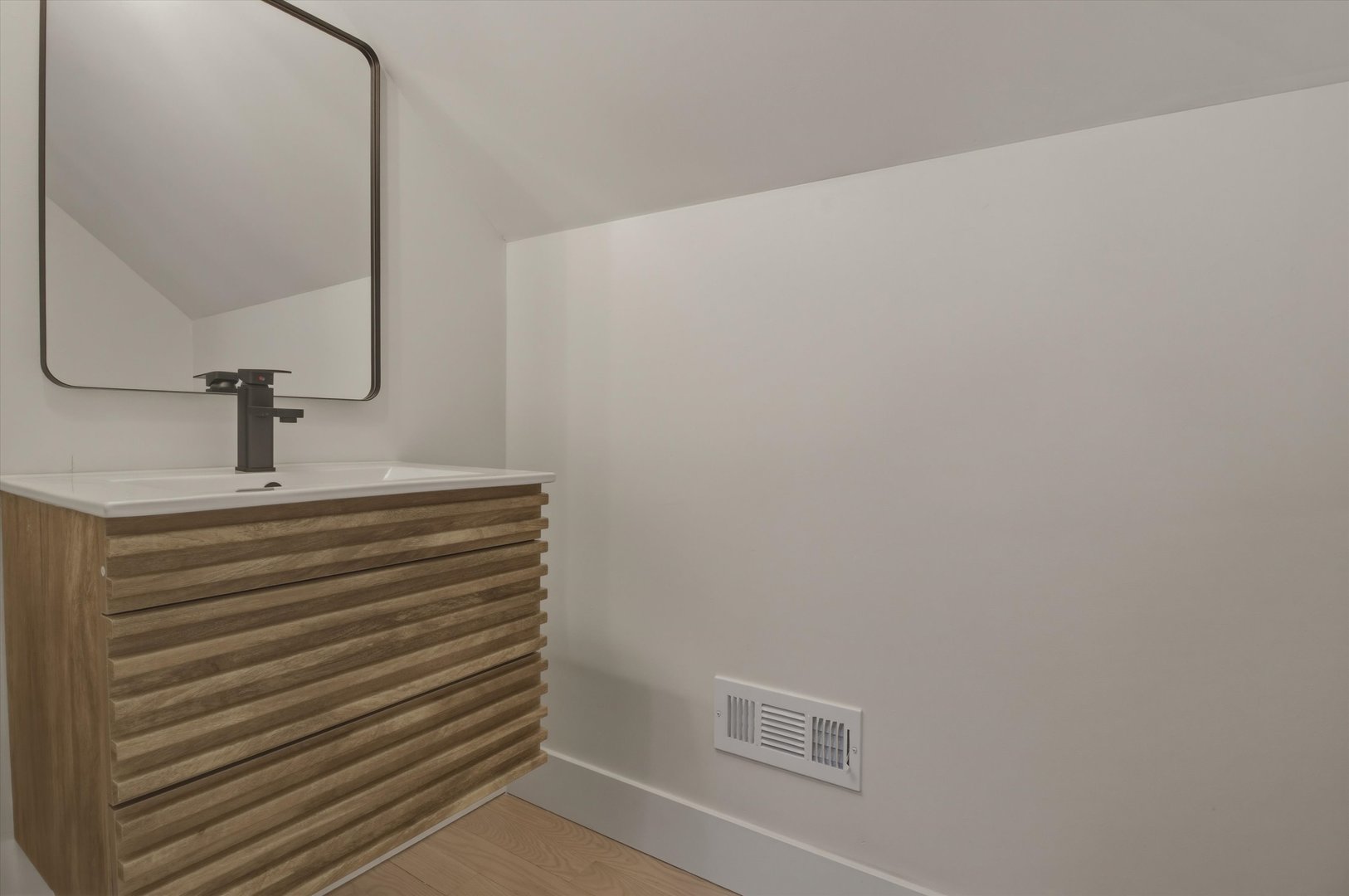 7230 South Avers Avenue Chicago, IL 60629 - Photo 23 of 44 a bathroom with a sink and a mirror