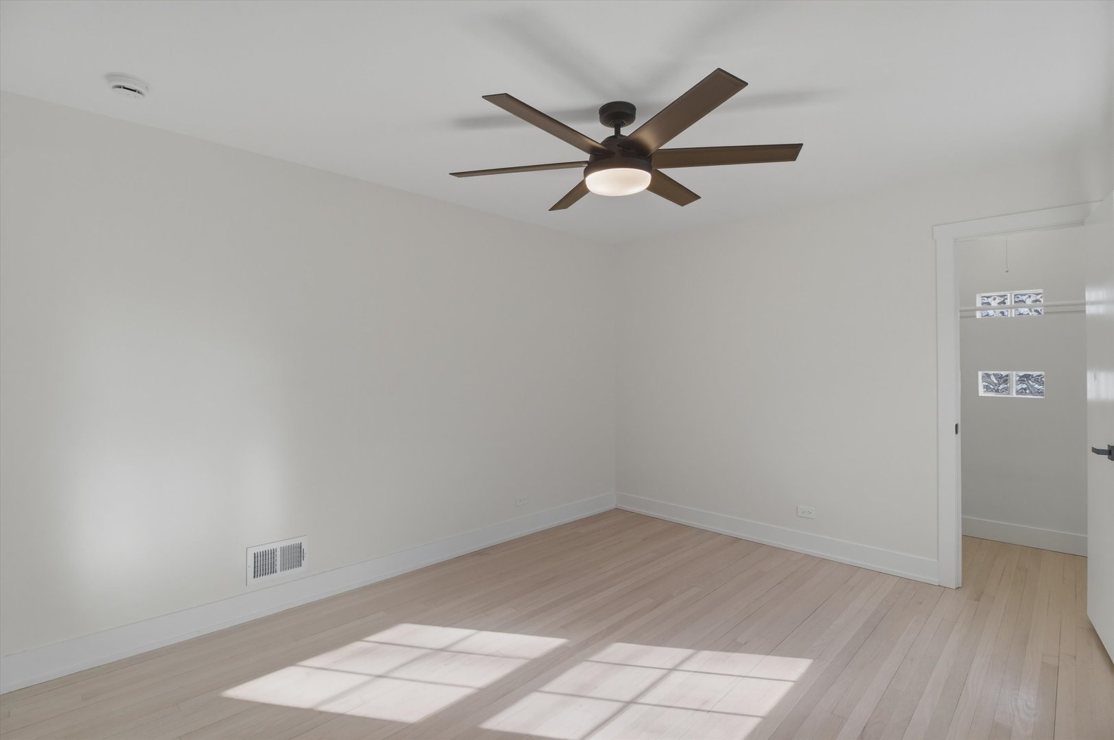 7230 South Avers Avenue Chicago, IL 60629 - Photo 26 of 44 a view of a big room with wooden floor and closet