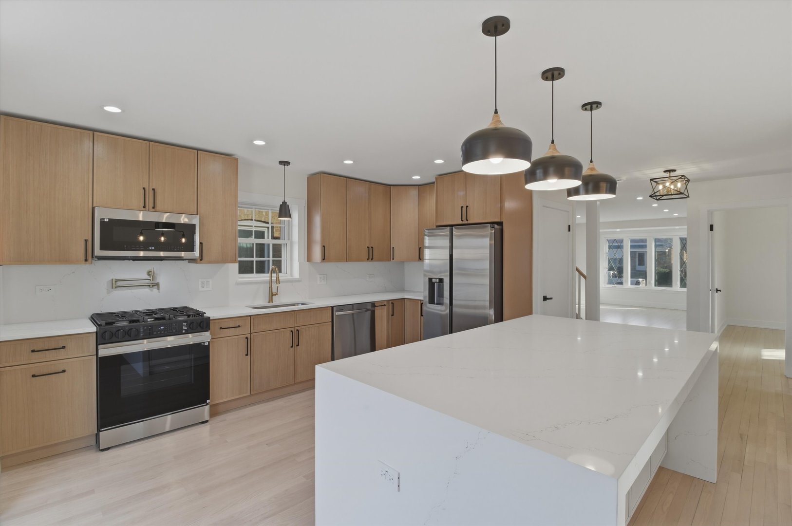 7230 South Avers Avenue Chicago, IL 60629 - Photo 10 of 44 a kitchen with stainless steel appliances a stove refrigerator sink and microwave