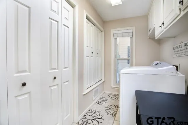 a utility room with dryer and washer