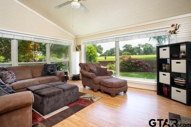 a living room with furniture and a flat screen tv