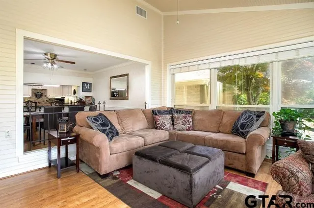 a living room with furniture and a large window